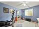 Sunny bedroom with modern exercise equipment and lots of natural light at 3201 W 126Th Ave, Broomfield, CO 80020