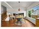 Bright dining room featuring hardwood floors, a modern light fixture, and natural light at 3201 W 126Th Ave, Broomfield, CO 80020