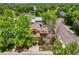 Aerial view of a home, surrounded by mature trees, in a suburban neighborhood at 3201 W 126Th Ave, Broomfield, CO 80020