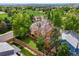 Aerial view of a well-maintained two-story home with mature trees and a fenced backyard at 3201 W 126Th Ave, Broomfield, CO 80020