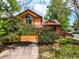 Charming two-story home featuring vibrant yellow siding, red trim, and mature landscaping at 3201 W 126Th Ave, Broomfield, CO 80020