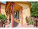 Cozy front porch featuring vibrant yellow siding, red trim, and a view of the garden at 3201 W 126Th Ave, Broomfield, CO 80020