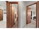 Hallway with doorways that provide glimpses into a bathroom and bedroom, offering a sense of spaciousness at 3201 W 126Th Ave, Broomfield, CO 80020