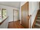 Inviting hallway featuring hardwood floors, neutral walls, and staircase at 3201 W 126Th Ave, Broomfield, CO 80020