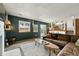 Living room shows a leather sectional, fireplace, and large window at 3201 W 126Th Ave, Broomfield, CO 80020