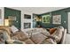 Comfortable living room boasts a brick fireplace and a large leather sectional at 3201 W 126Th Ave, Broomfield, CO 80020