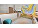 Bright loft area featuring colorful wall art, area rug, and comfortable seating at 3201 W 126Th Ave, Broomfield, CO 80020