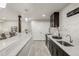 Finished basement boasting a stylish bar area with stone accents and room for a beverage cooler at 1365 W 67Th Pl, Denver, CO 80221