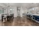 Open floor plan with dining room, kitchen, and living area featuring hardwood floors at 1365 W 67Th Pl, Denver, CO 80221