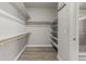 Spacious walk-in closet with built-in shelving provides ample storage and organization options at 1365 W 67Th Pl, Denver, CO 80221