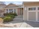 Charming front exterior of a suburban home with landscaped yard, walkway, and two-car garage at 10302 Tennyson Ct, Westminster, CO 80031