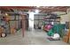 Unfinished basement with exposed pipes and storage shelves at 7490 W Coal Mine Ave # A, Littleton, CO 80123