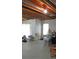Unfinished basement space with exposed ceiling and sliding door at 7490 W Coal Mine Ave # A, Littleton, CO 80123