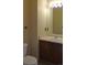 Half bath with vanity, mirror and toilet at 7490 W Coal Mine Ave # A, Littleton, CO 80123