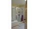 Tiled shower with glass door in bathroom at 7490 W Coal Mine Ave # A, Littleton, CO 80123