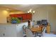 Inviting dining area adjoining a kitchen with wood cabinets at 7490 W Coal Mine Ave # A, Littleton, CO 80123