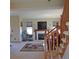 Comfortable living room with a cozy fireplace and staircase at 7490 W Coal Mine Ave # A, Littleton, CO 80123
