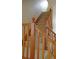 Carpeted staircase with wooden railing at 7490 W Coal Mine Ave # A, Littleton, CO 80123