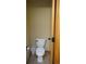 Toilet with a tile floor and door for privacy at 7490 W Coal Mine Ave # A, Littleton, CO 80123