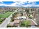 An aerial view that showcases the home's setting within a tranquil neighborhood and close proximity to a green park at 100 Balsam St, Lakewood, CO 80226