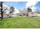 Wide backyard showcasing an expansive lawn, perfect for recreation and gardening at 100 Balsam St, Lakewood, CO 80226