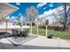 Large backyard with a dining area, a grill, and ample green space at 100 Balsam St, Lakewood, CO 80226