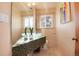 Bathroom with a unique vanity, eye-catching sink bowls, and a mirror extending the full length at 100 Balsam St, Lakewood, CO 80226