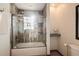 Bathroom with a shower-over-bath featuring decorative tile surround at 100 Balsam St, Lakewood, CO 80226