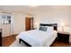 Bedroom featuring hardwood floors, neutral paint, and natural light at 100 Balsam St, Lakewood, CO 80226