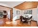 Dining room with hardwood flooring, wood ceiling, and an open floor plan, great for entertaining at 100 Balsam St, Lakewood, CO 80226