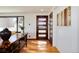 Inviting entryway with a modern door, hardwood floors, and stylish console table at 100 Balsam St, Lakewood, CO 80226