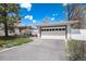 Image showing the home with an attached garage and long driveway at 100 Balsam St, Lakewood, CO 80226