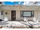 Inviting front porch with white Adirondack chairs, perfect for relaxing outdoors at 100 Balsam St, Lakewood, CO 80226