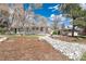 A well-kept home, front yard with manicured garden, and decorative rocks for enhanced curb appeal at 100 Balsam St, Lakewood, CO 80226