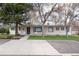 Charming home featuring a well-manicured front yard, a symmetrical walkway, and classic white Adirondack chairs at 100 Balsam St, Lakewood, CO 80226