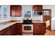 Well-appointed kitchen with stainless steel appliances and granite countertops at 100 Balsam St, Lakewood, CO 80226