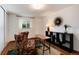 Bright and airy office with hardwood floors, modern shelving, and stylish decor at 100 Balsam St, Lakewood, CO 80226