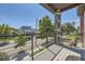 Balcony with a view of a tree-lined street in a residential neighborhood at 2627 S Acoma St, Denver, CO 80223