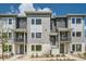 Modern townhome exterior boasts a contemporary design with clean lines, multiple stories, and inviting front entrances at 682 Belay St, Erie, CO 80516
