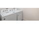 Modern laundry room equipped with a new washer and dryer at 2212 Crosswind St, Fort Lupton, CO 80621
