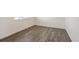 Cozy room showcasing the wood floors, white trim, and natural light at 2212 Crosswind St, Fort Lupton, CO 80621