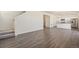 Modern living area with beautiful floors and neutral colors throughout at 2212 Crosswind St, Fort Lupton, CO 80621