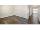 Spacious, light-filled room featuring modern flooring and an open layout at 2212 Crosswind St, Fort Lupton, CO 80621