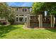 Spacious backyard featuring a lush lawn and deck, ideal for outdoor gatherings and enjoying the scenery at 5755 W Berry Ave, Denver, CO 80123