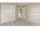 Carpeted bedroom with closet and entry to the upper floor at 5755 W Berry Ave, Denver, CO 80123