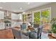 Dining area leading to deck and featuring stainless steel appliances and modern finishes at 5755 W Berry Ave, Denver, CO 80123