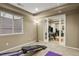 Exercise room with carpeted floors, a window for natural light, and workout equipment at 5755 W Berry Ave, Denver, CO 80123