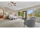 Spacious main bedroom featuring vaulted ceilings, large windows, and ensuite bathroom at 5755 W Berry Ave, Denver, CO 80123