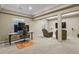 Office space featuring multiple monitors, an office chair, carpeted floors, and access to a nearby lounge at 5755 W Berry Ave, Denver, CO 80123