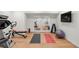 Home gym equipped with workout machines, mirrored wall, and fitness accessories for convenient exercise at 73 Glenmoor Dr, Cherry Hills Village, CO 80113